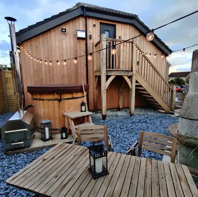 Private wood-fired hot tub at The Studio Cheddar with open Mendip Hills countryside views — romantic couples retreat and luxury self-catering near Cheddar Gorge, Somerset